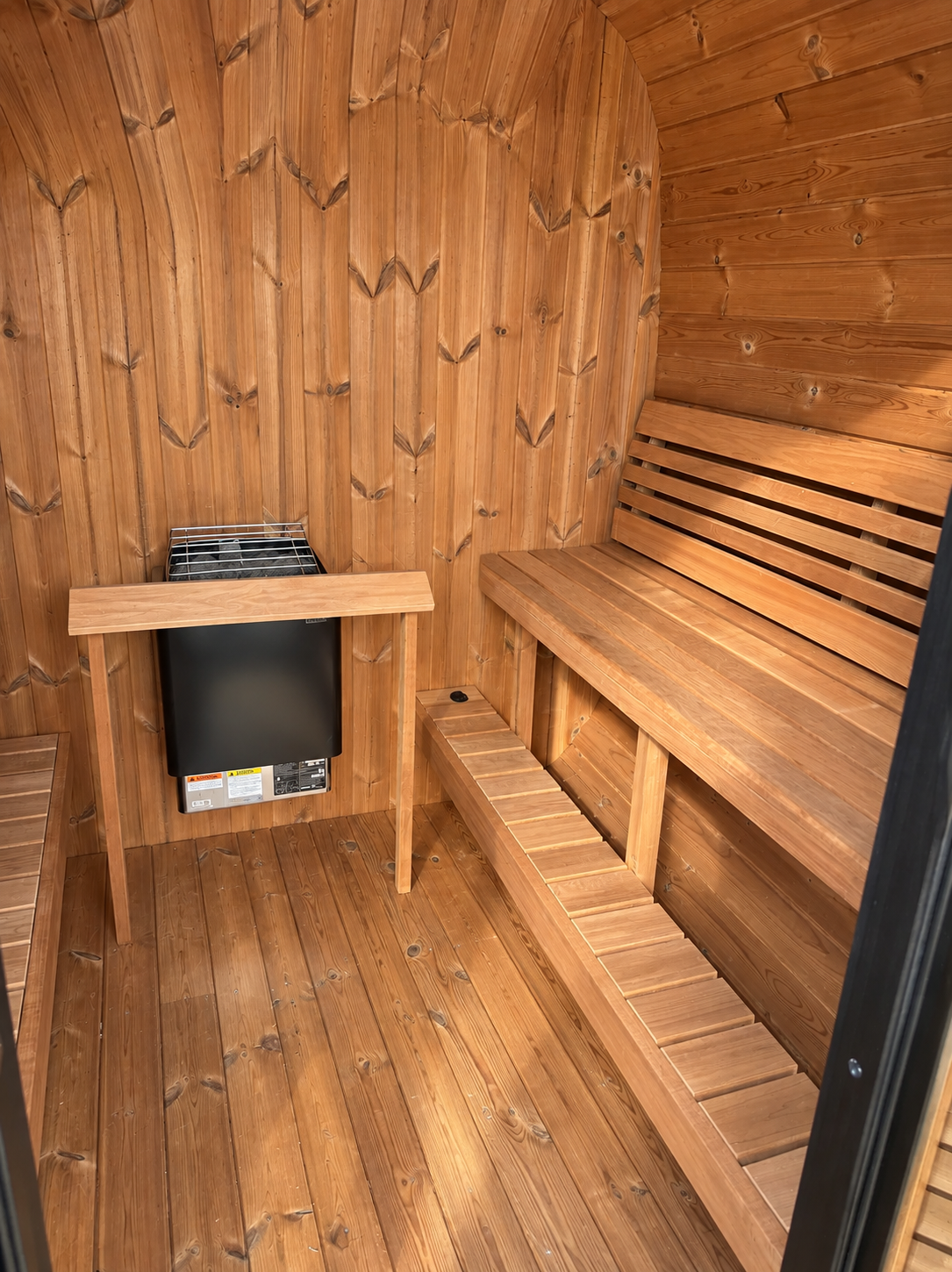 SaunaLife CL7G interior with benches and wooden heater guard. Heater shown is chosen separately