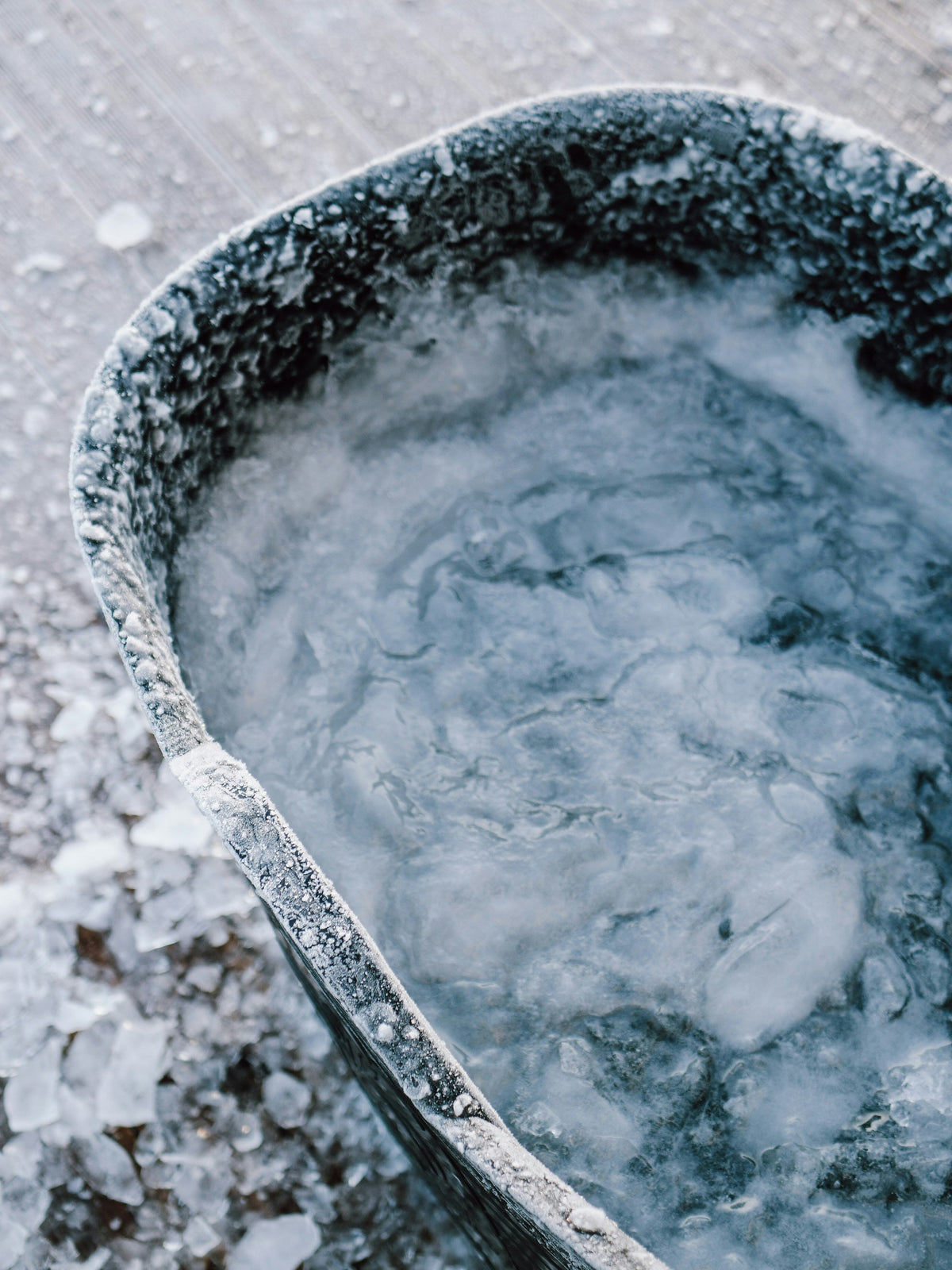 Frosted cold plunge tub with still water outdoors