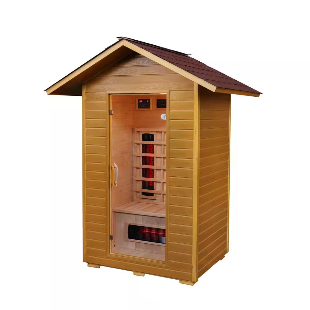 Outdoor infrared sauna cabin with peaked roof, exterior cladding, door open showing heaters
